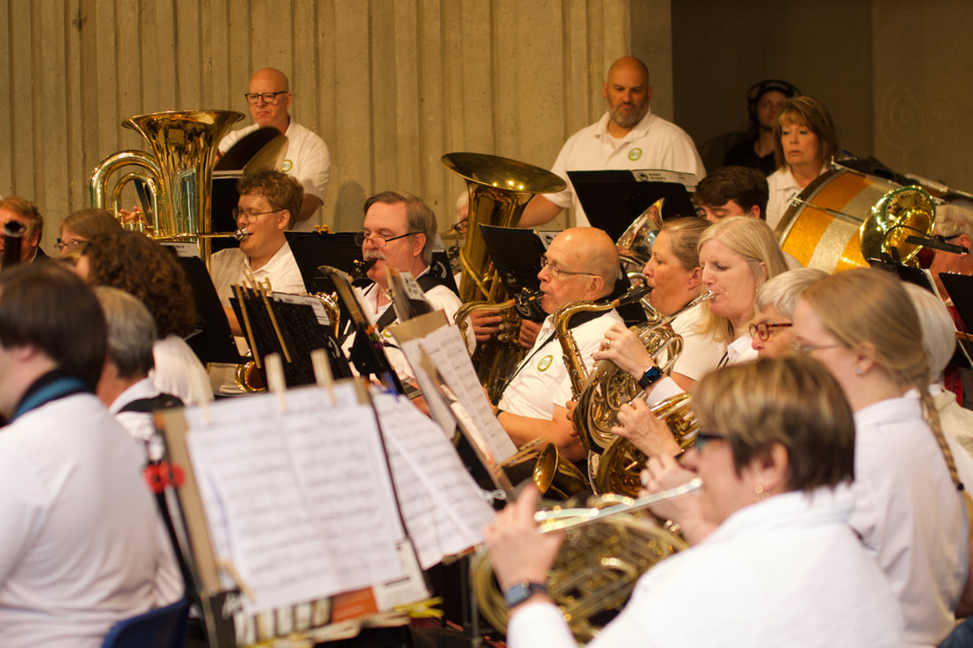 Community Band musicians perform together.