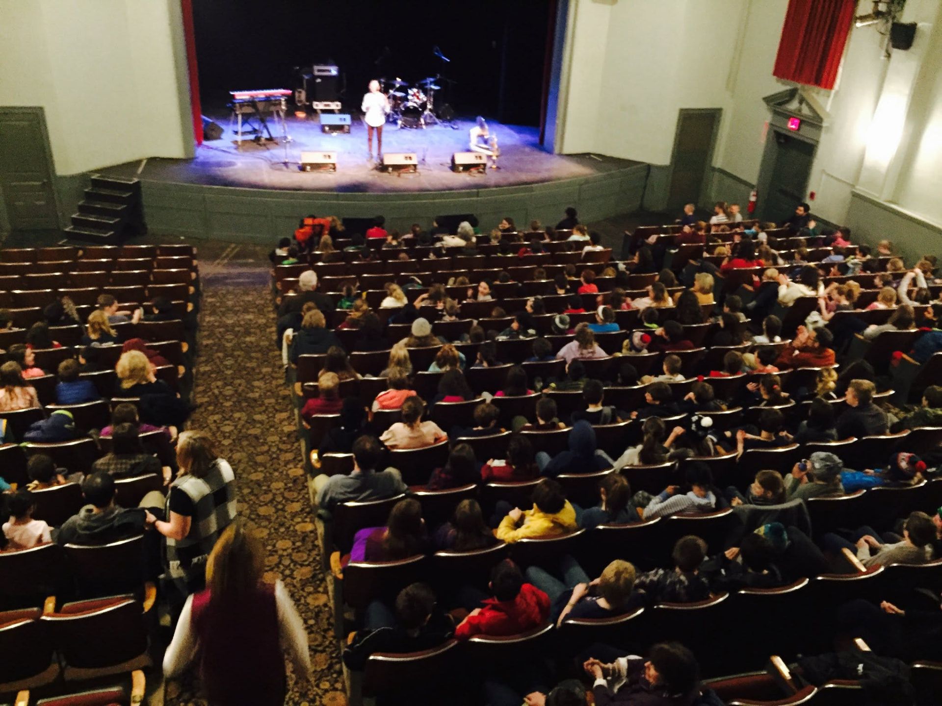 Audience members seated in the Woodstock Town Hall Theatre during a performance.