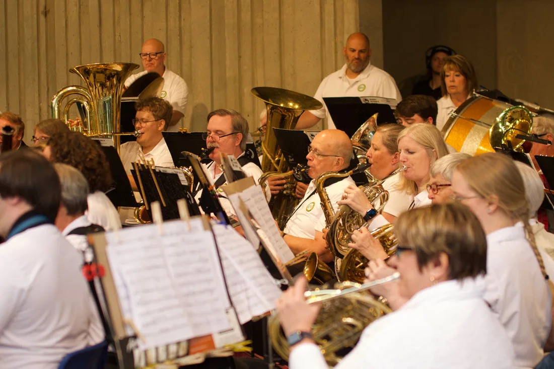 Community Band musicians perform together.