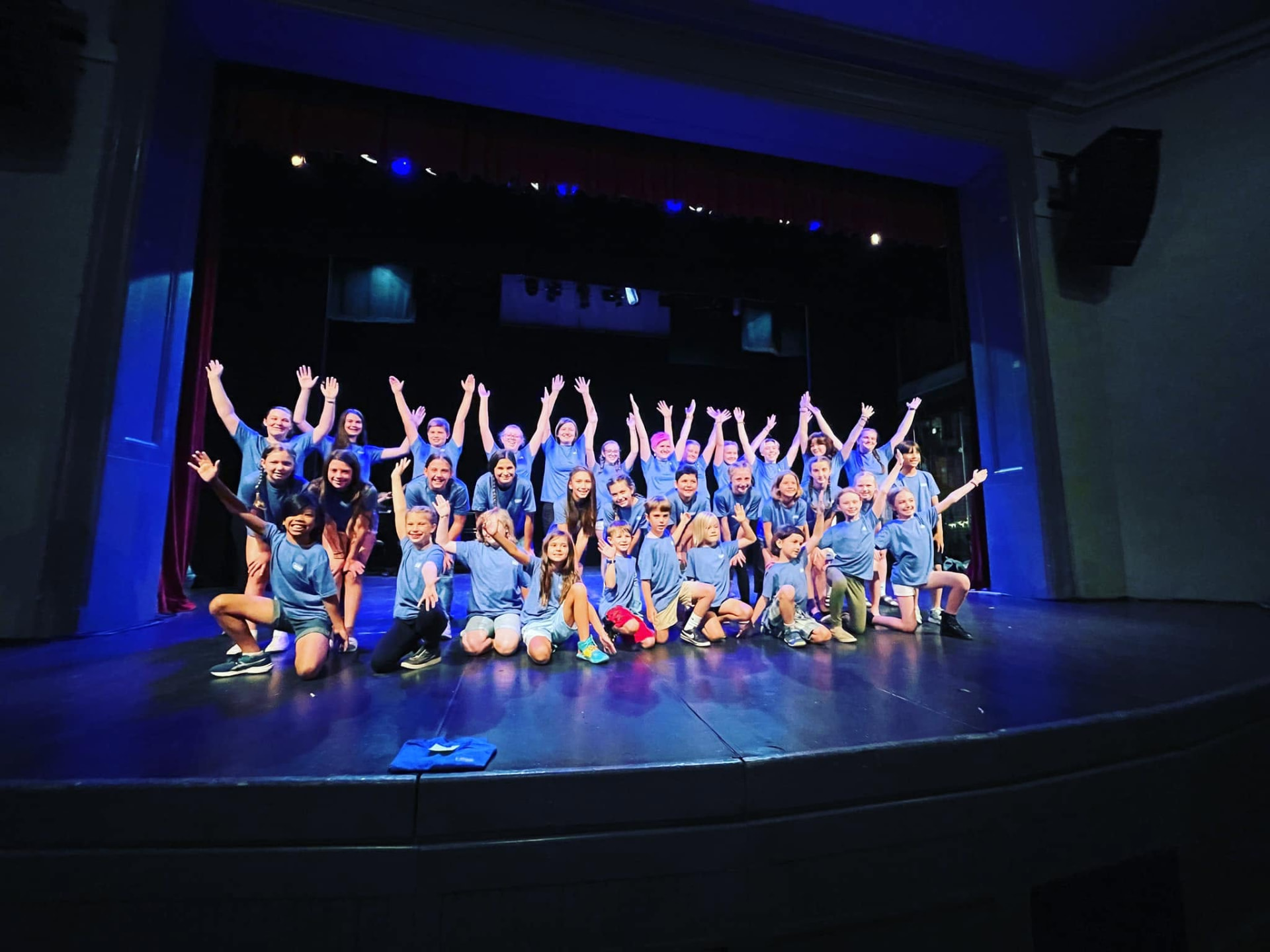 Summer Youth Theatre participants gathered together on stage after a performance