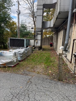 Green room access area beside the Woodstock Town Hall Theatre, showing the outdoor walkway and space planned for improvements.
